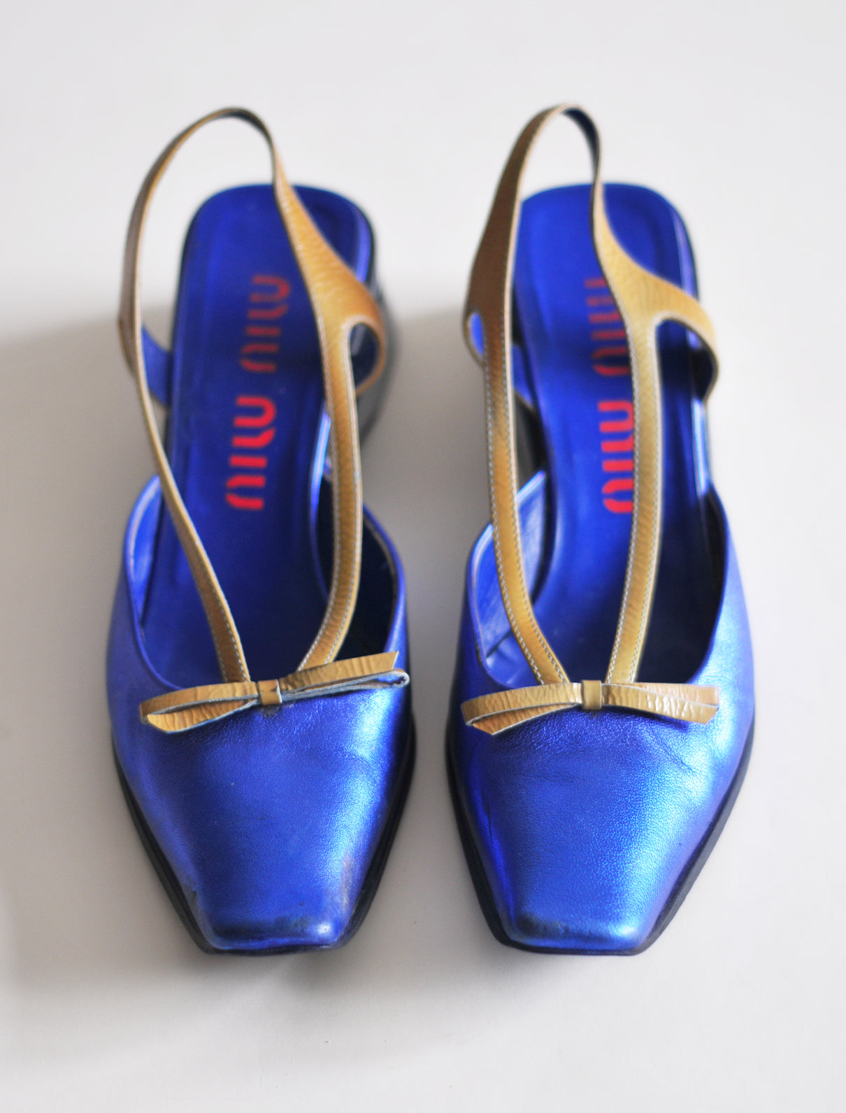 Miu Miu metallic blue platforms