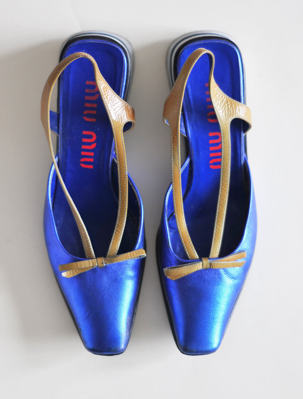 Miu Miu metallic blue platforms