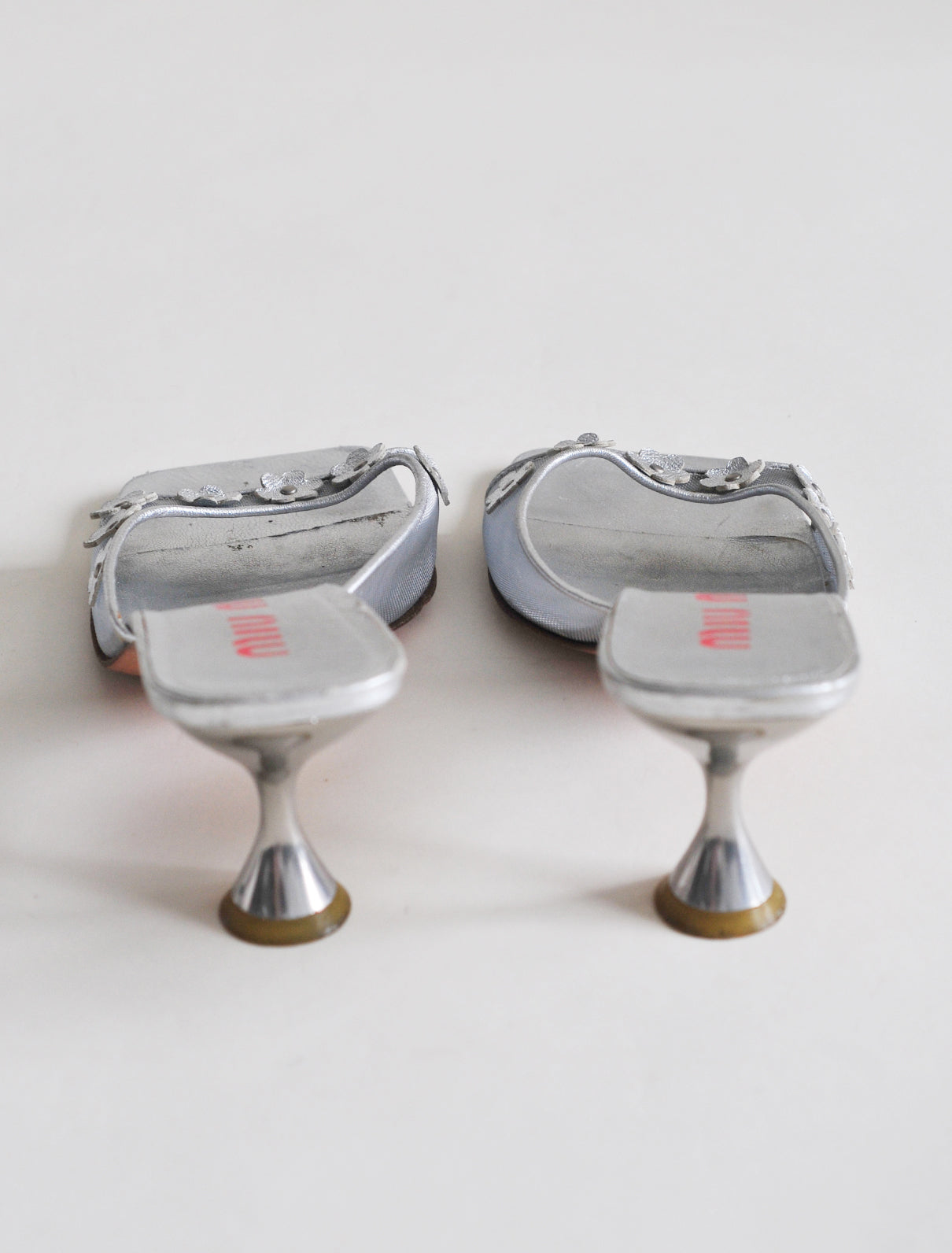 Miu Miu silver daisy heels