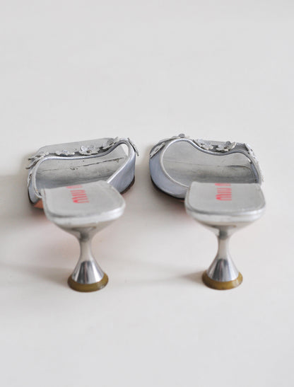 Miu Miu silver daisy heels