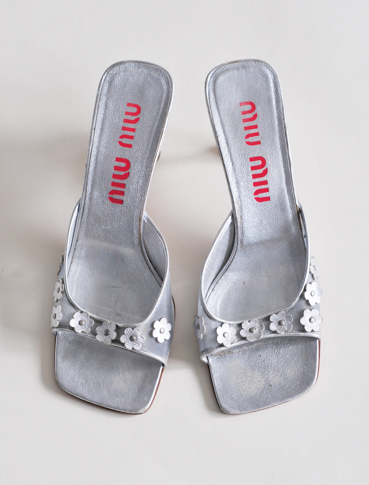 Miu Miu silver daisy heels
